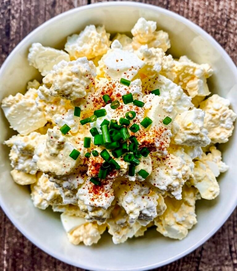 A creamy 5-Minute Cottage Cheese Egg Salad Bowl garnished with fresh chives and smoked paprika.